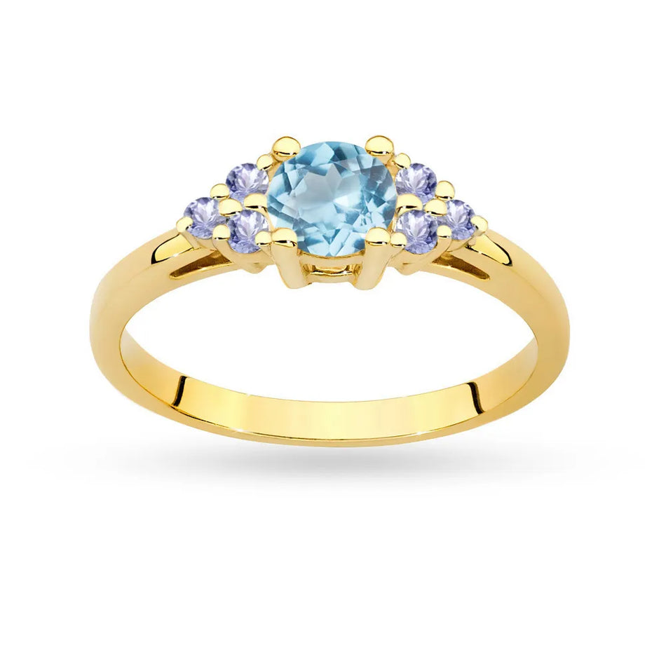 Prsteň zo žltého zlata 14k(585) s topásom 0,50 ct a 6 tanzanitmi. Perfektný ako darček.
