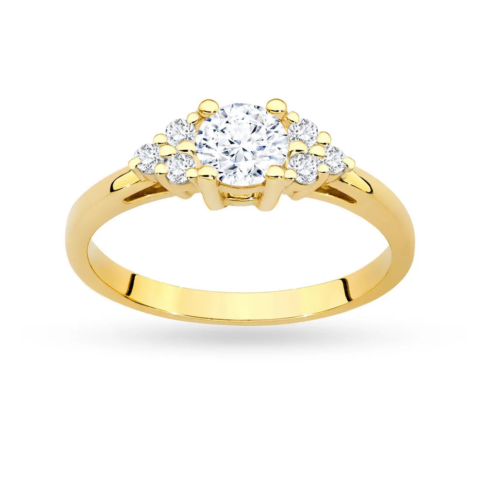 Prsteň zo žltého zlata 14k(585) so 0,60 ct bielym zafírom a 6 diamantmi. Perfektný ako darček.