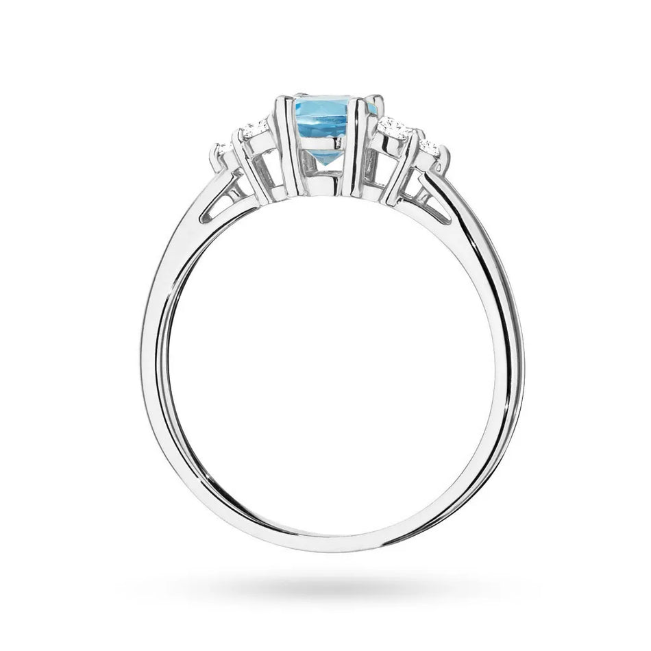 Prsteň z bieleho zlata 14k(585) s topásom 0,50 ct a 6 diamantmi. Perfektný ako darček.