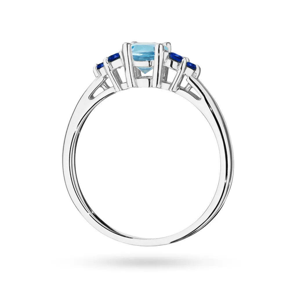 Prsteň z bieleho zlata 14k(585) s topásom 0,50 ct a 6 zafírmi. Perfektný ako darček.