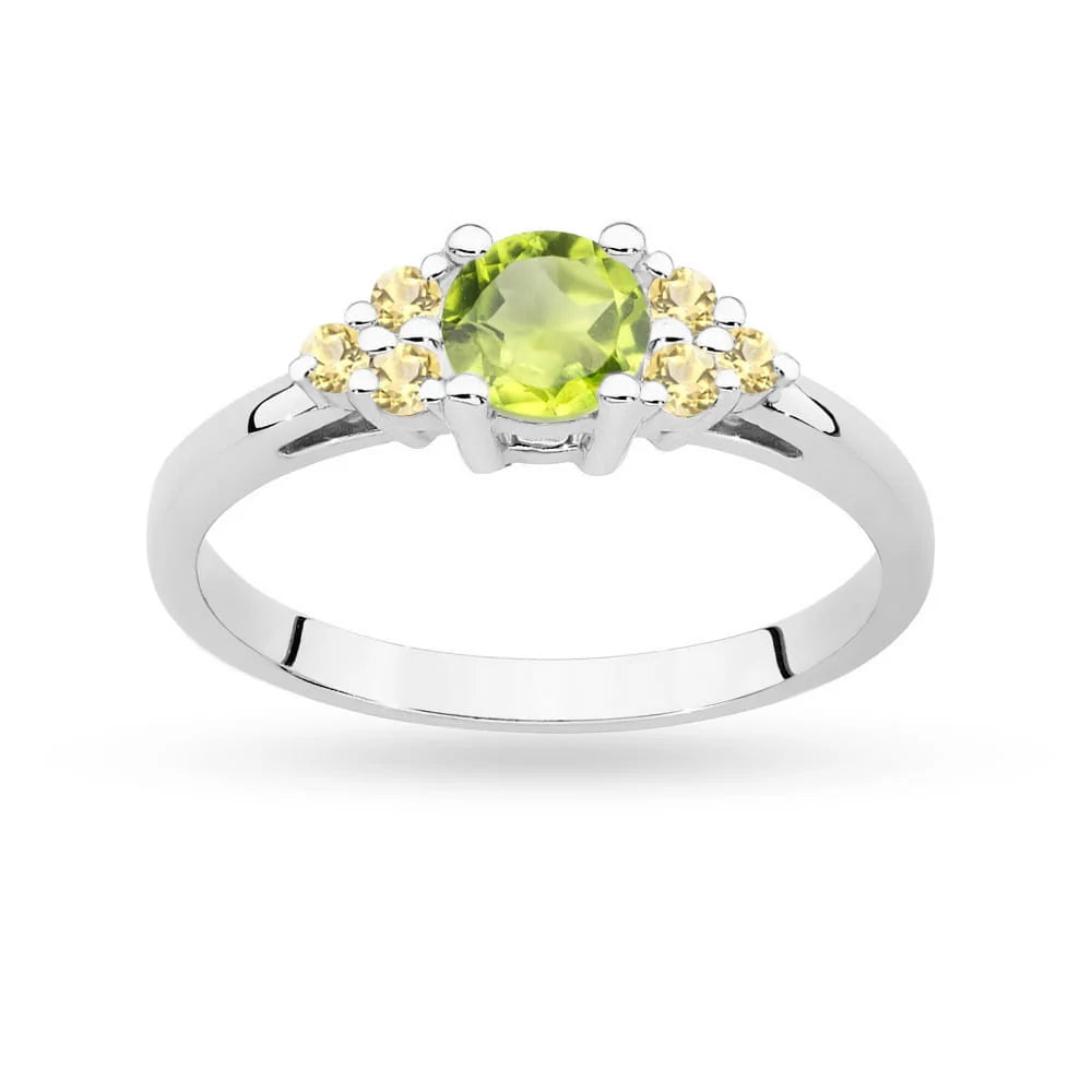 Prsteň z bieleho zlata 14k(585) s olivínom 0,60 ct a 6 bronzovými diamantmi. Perfektný ako darček.