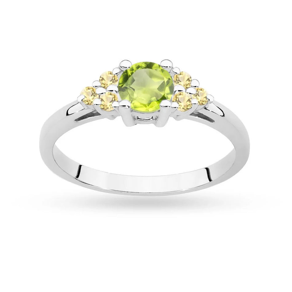 Prsteň z bieleho zlata 14k(585) s olivínom 0,60 ct a 6 bronzovými diamantmi. Perfektný ako darček.