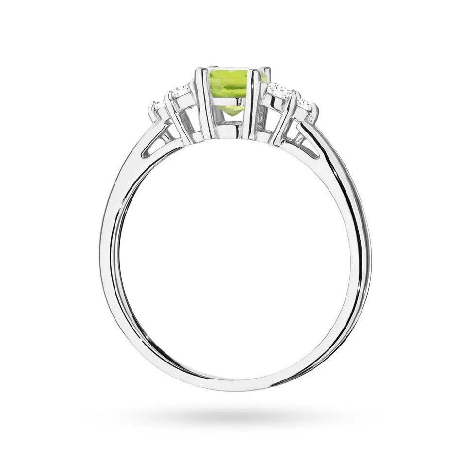 Prsteň z bieleho zlata 14k(585) s olivínom 0,60 ct a 6 diamantmi. Perfektný ako darček.