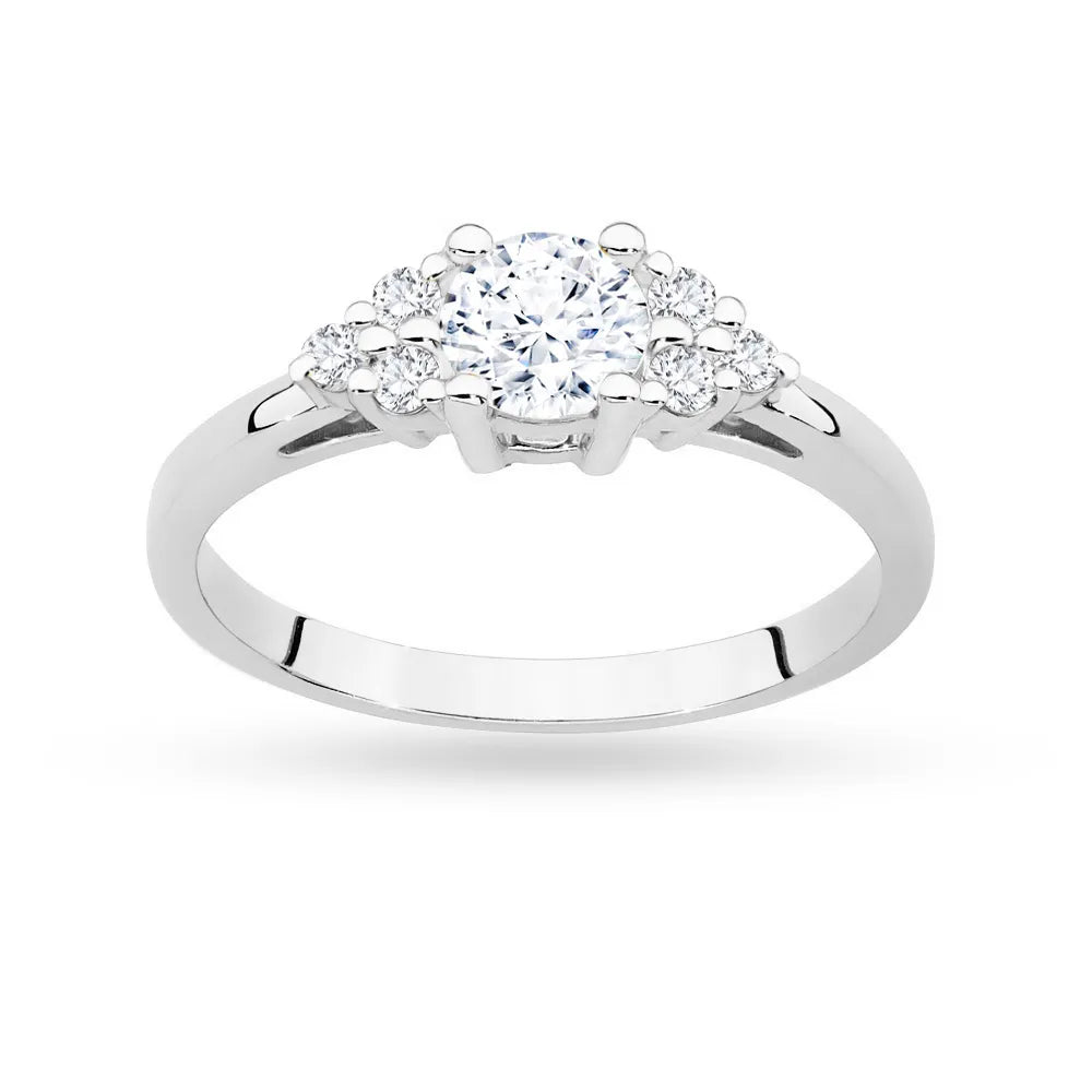 White Gold 14k(585) ring with 0,60ct white sapphire with 6 diamonds. Perfect for a gift.