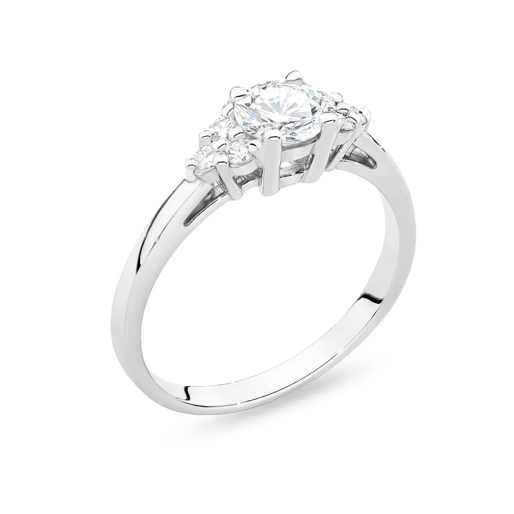 White Gold 14k(585) ring with 0,60ct white sapphire with 6 diamonds. Perfect for a gift.