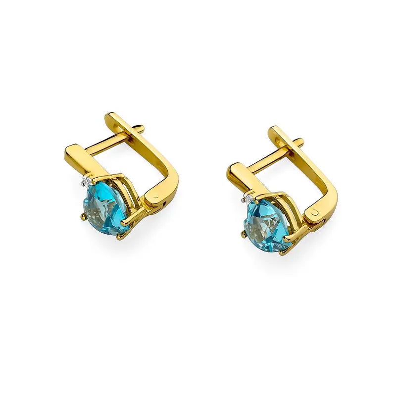 Náušnice zo 14-karátového zlata s 1,20 ct srdcovým topásom a diamantmi. Zabalené v elegantnej krabičke, sú ideálne ako darček.