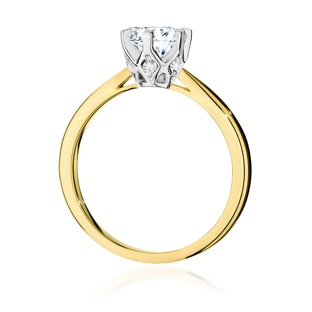 Prsteň zo žltého zlata 14k(585) s diamantom 1 ct a postrannými diamantmi 0,06 ct. Perfektný ako darček.
