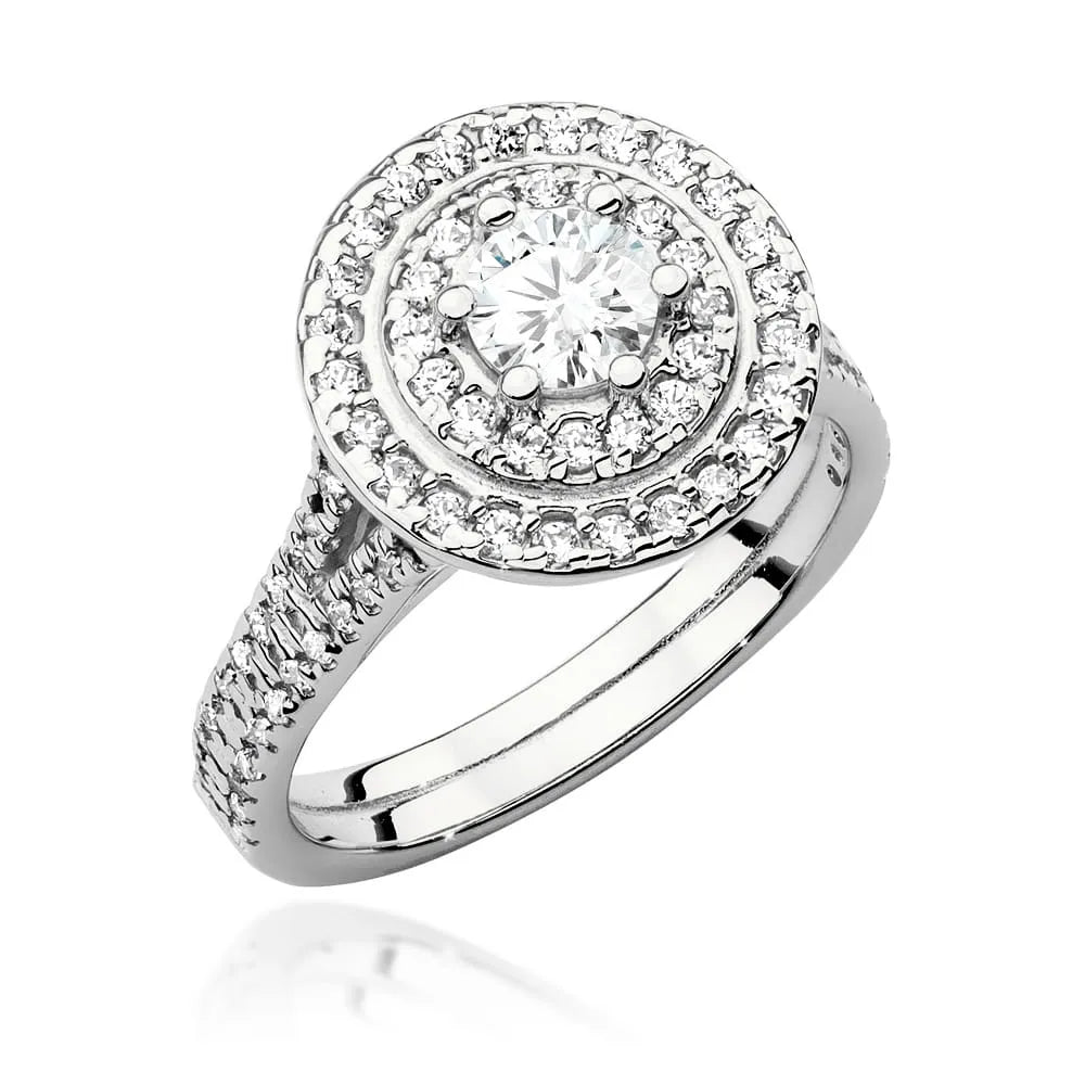 Náušnice z bieleho zlata 14k(585) s diamantom 0,40 ct a postrannými diamantmi 0,613 ct. Balené v elegantnej krabičke, ktorá je ideálna ako darček.