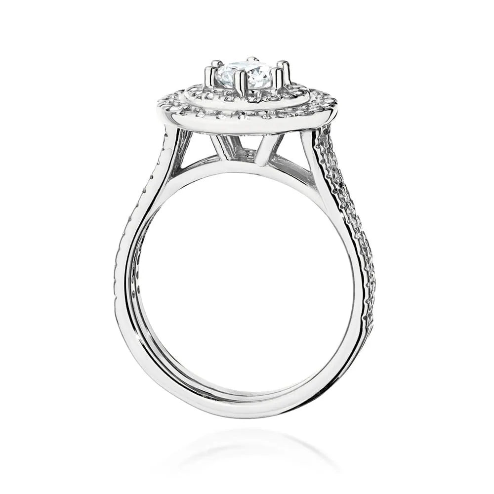 Náušnice z bieleho zlata 14k(585) s diamantom 0,40 ct a postrannými diamantmi 0,613 ct. Balené v elegantnej krabičke, ktorá je ideálna ako darček.