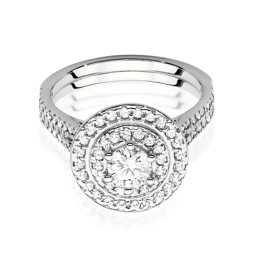 Náušnice z bieleho zlata 14k(585) s diamantom 0,40 ct a postrannými diamantmi 0,613 ct. Balené v elegantnej krabičke, ktorá je ideálna ako darček.