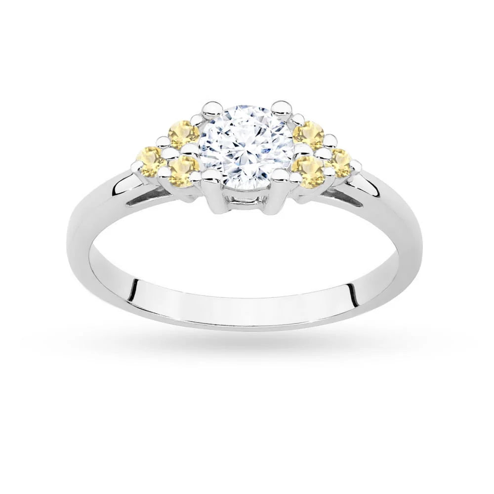 White Gold 14k(585) ring with 0,60ct white sapphire with 6 bronze diamonds. Perfect for a gift.
