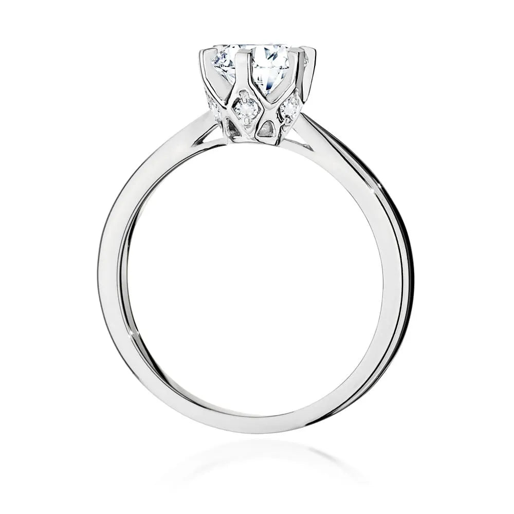 White Gold 14k(585) ring with 1ct diamond and 0,06ct side diamonds.  Perfect for a gift.