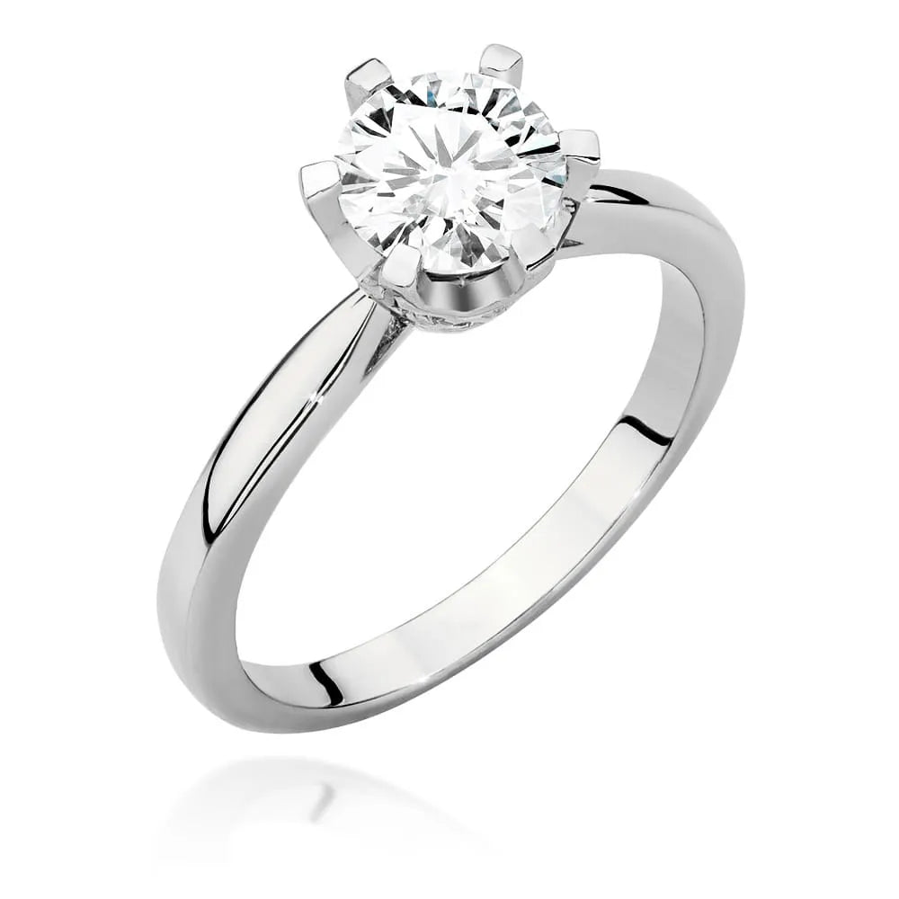 White Gold 14k(585) ring with 1ct diamond and 0,06ct side diamonds.  Perfect for a gift.