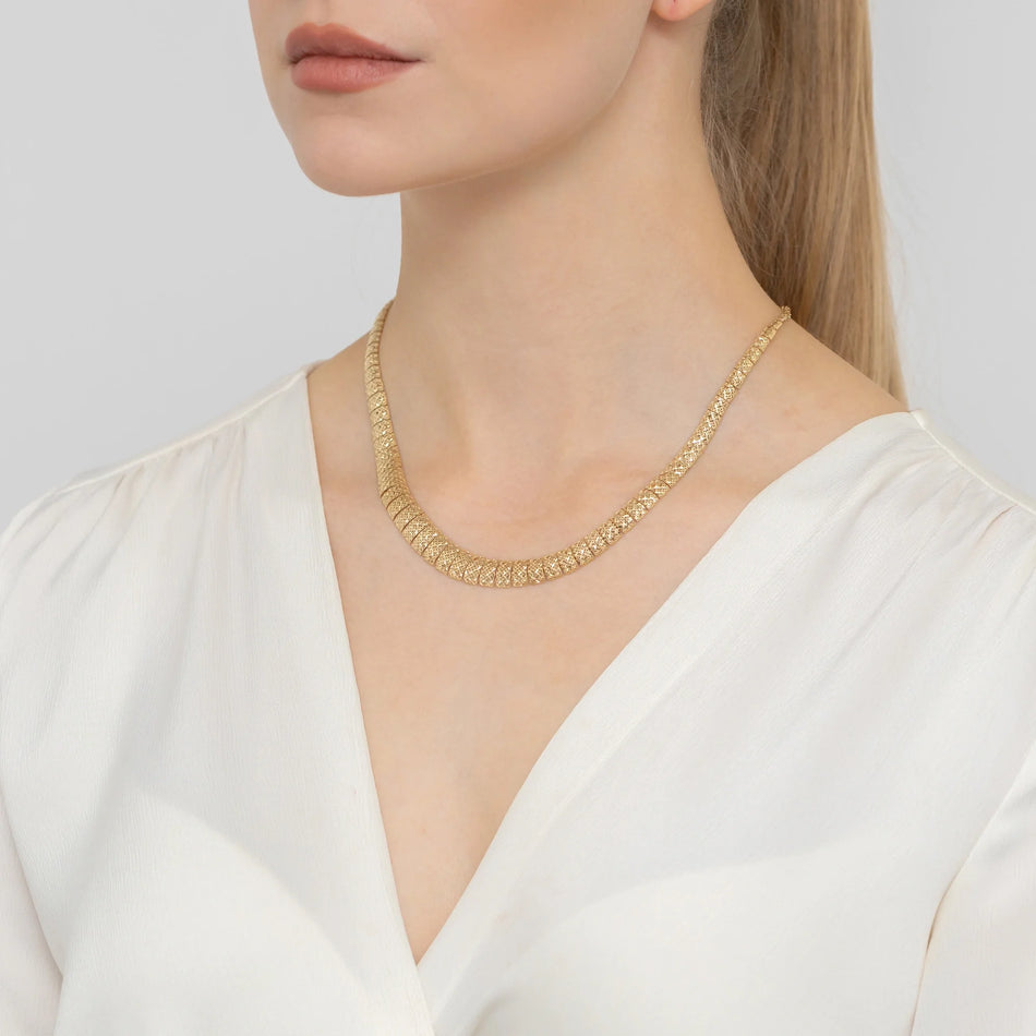 Gold collar necklace with diamond-cut rectangular segments