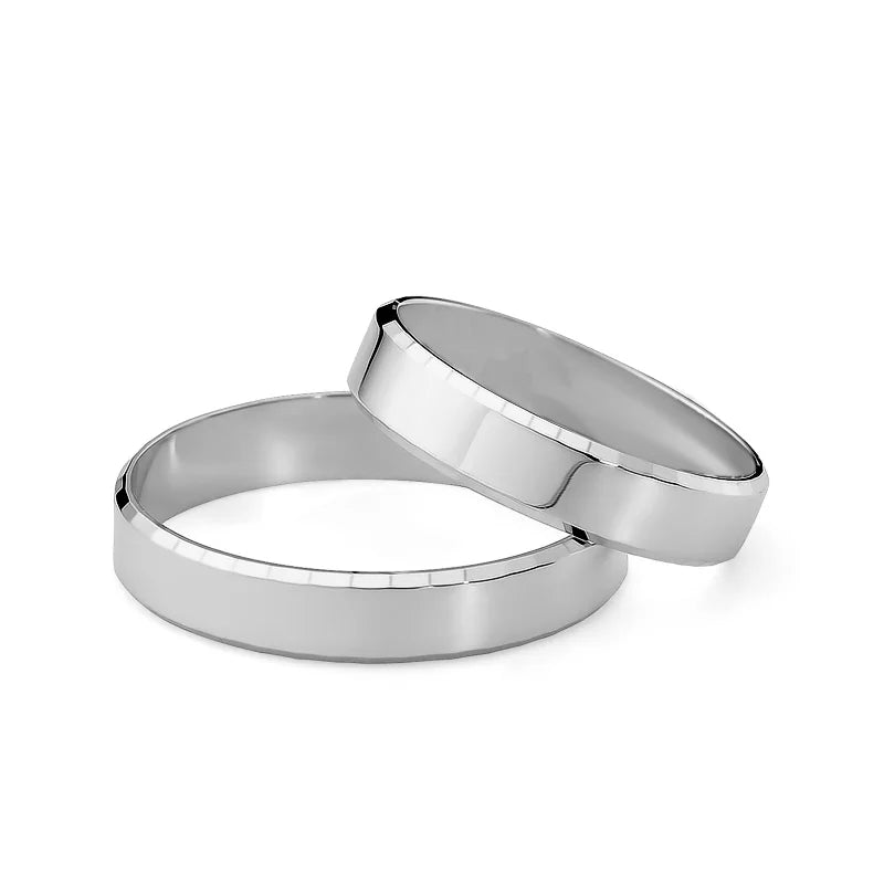 Klasické svadobné obrúčky z bieleho zlata s diamantovo brúsenými hranami, 4 mm