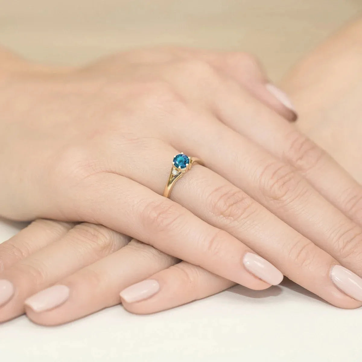 gold-ring-with-0-50ct-topaz-london-blue-and-diamonds-w0076-tol-01