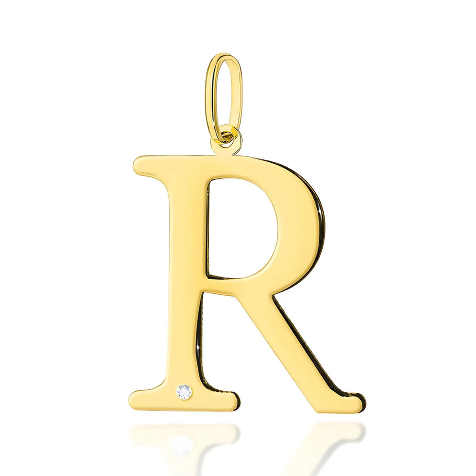 Veľký prívesok zo žltého zlata s iniciálou „R“ a diamantom