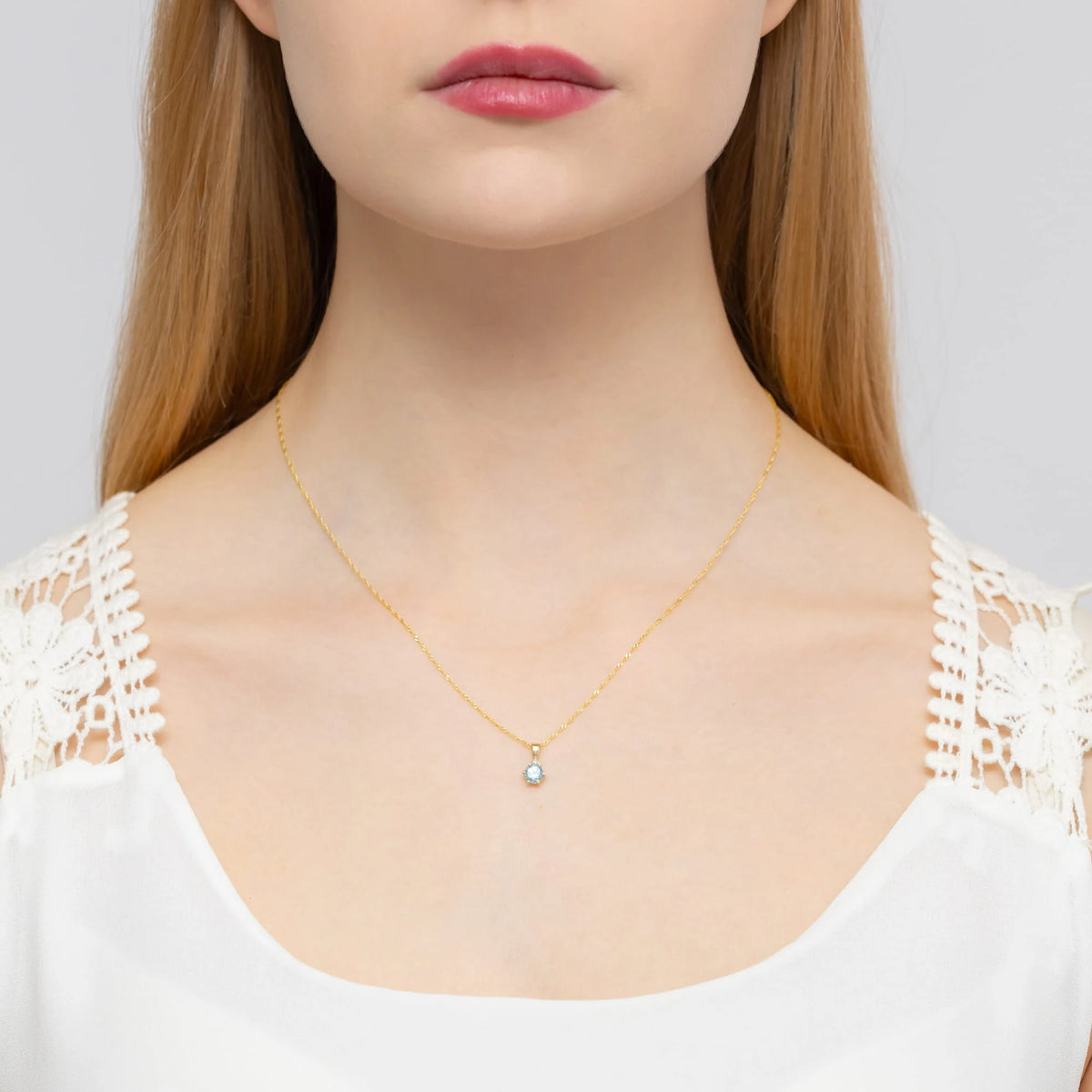 zlatý prívesok s topásom 0,50 ct a diamantmi 0,015 ct z0076-tob-01