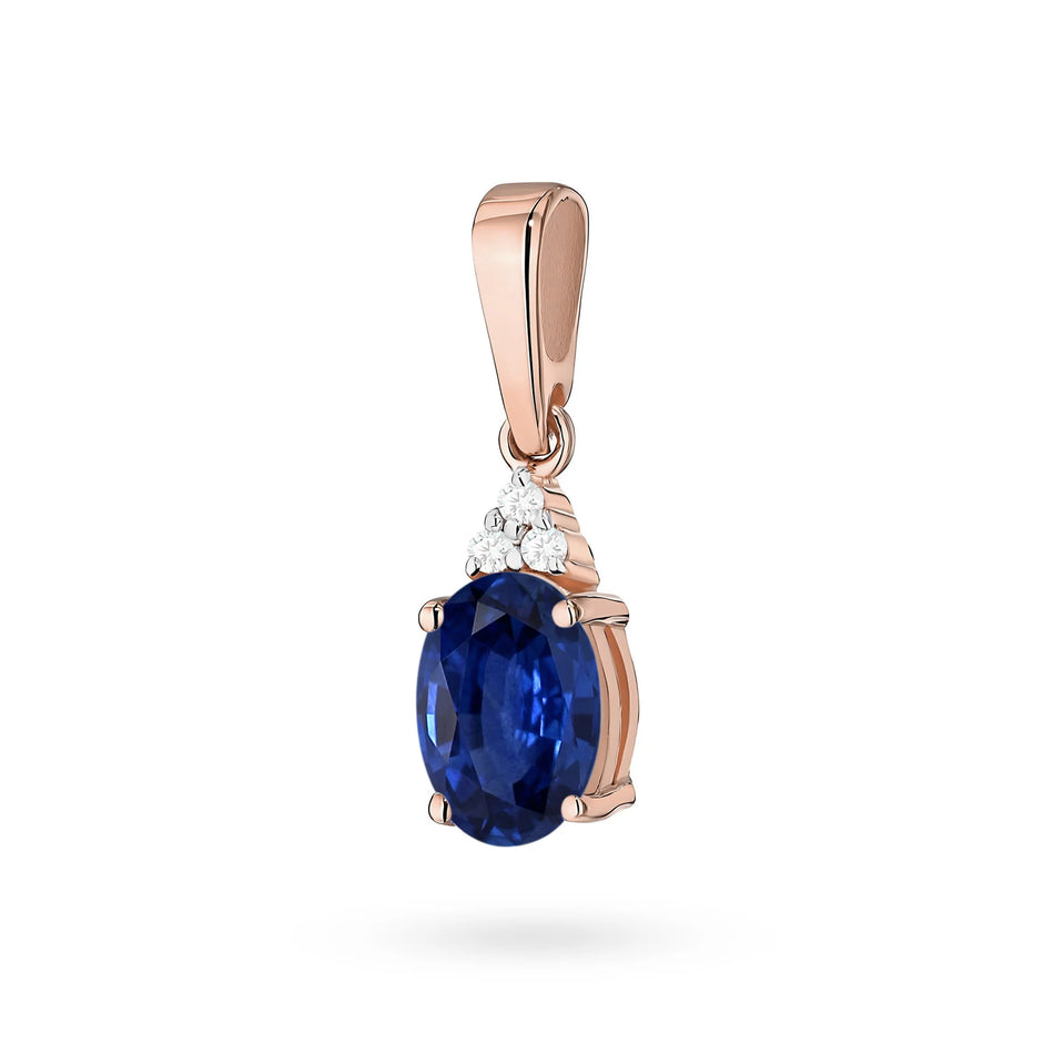 Pendant made of the 14K (585) gold. Our offer includes chains, pendants, necklaces. Central oval cut sapphire 0.90ct and 3 diamonds 0.026ct. Perfect unique gift